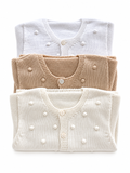 Gilet en maille à pompons